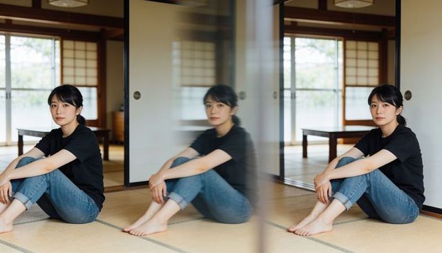 Sitting woman reflecting in glass on tatami in traditional japanese room minimalist calm