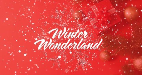 Winter wonderland script lettering on red festive backdrop with glitter snowflake