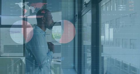 Businessman contemplating with digital analytics interface