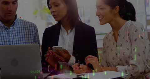 Collaborative Office Work with Team Analyzing Financial Data