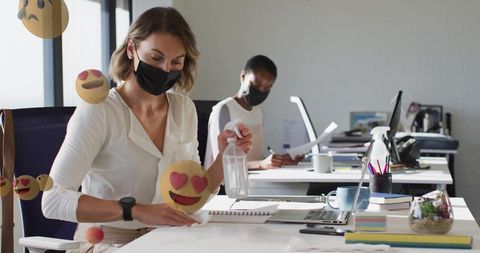 Office worker maintains hygiene in modern workspace