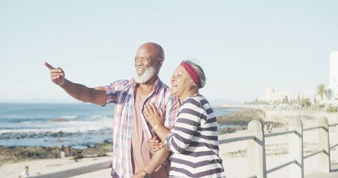 Happy Senior Couple Enjoying Beach Promenade View - Download Free Stock Images Pikwizard.com