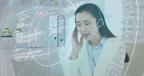 asian businesswoman analyzing data with headset in office - Download Free Stock Images Pikwizard.com