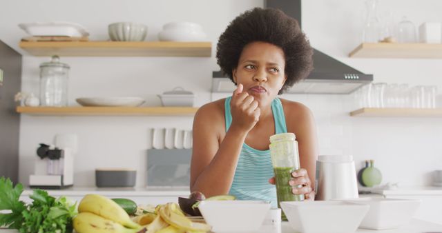 Woman Drinking Green Smoothie in Modern Kitchen - Download Free Stock Images Pikwizard.com