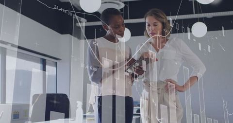 Business Professionals Analyzing Data with Graph Visualizations