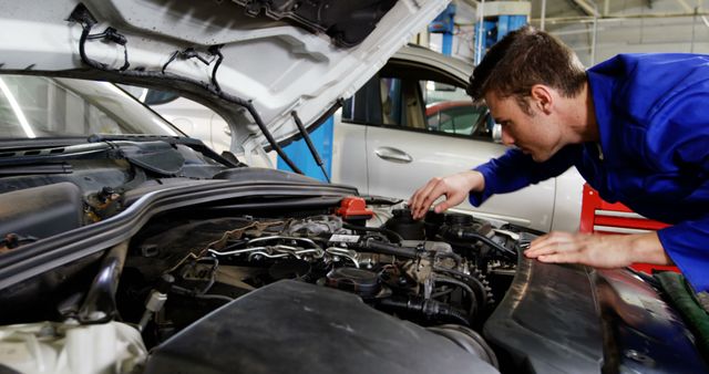 Young Mechanic Diagnosing Car Engine in Auto Repair Shop - Download Free Stock Images Pikwizard.com