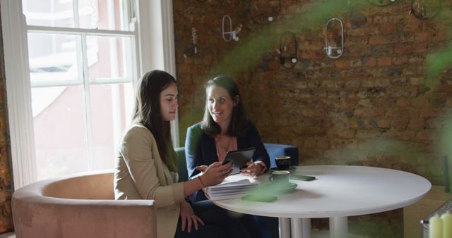 Two Businesswomen Having a Meeting in Cozy Cafe - Download Free Stock Images Pikwizard.com