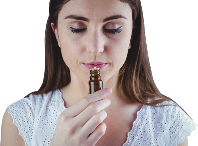 Woman Smelling Transparent Essential Oil Bottle - Download Free Stock Videos Pikwizard.com