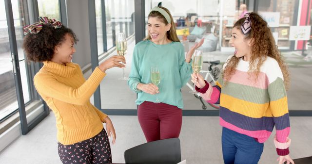 Group of Women Celebrating with Champagne at Office - Download Free Stock Images Pikwizard.com