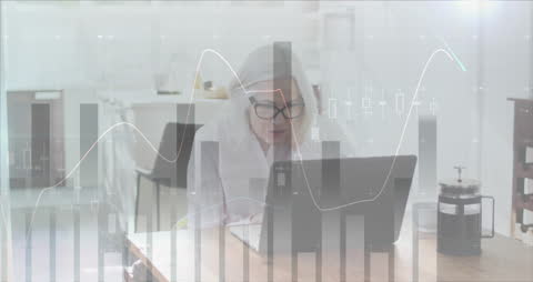 Senior Woman Analyzing Data on Laptop with Graphic Overlay