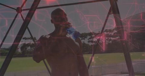 Athletic Man Drinking Water In Sunny Outdoor Fitness Setting