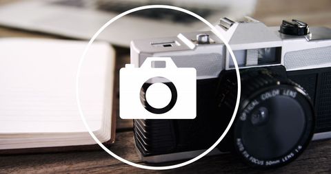 Vintage Camera on Desk with White Circle Icon Overlay - Download Free Stock Images Pikwizard.com