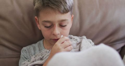 Sick Child Indoors Dealing with a Cold During Pandemic