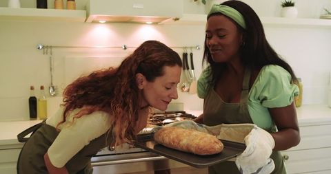 Diverse Friends Baking Bread in Cozy Kitchen Environment