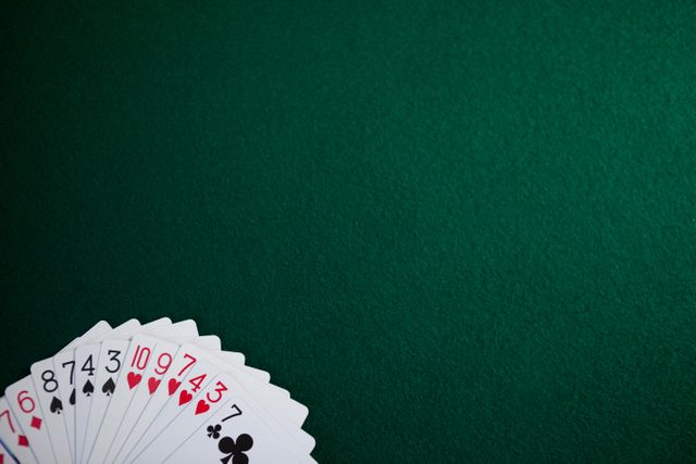 Playing cards arranged on poker table in casino