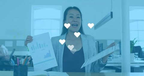 Businesswoman Analyzing Reports with Social Media Overlay