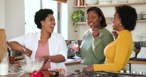 Friends Enjoying Baking Together in Home Kitchen