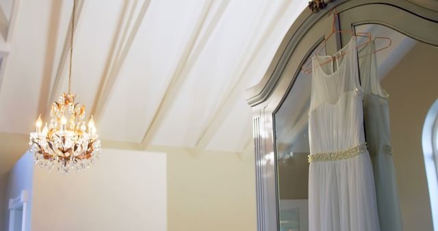 Elegant White Wedding Dress Hanging on Vintage Armoire in Bright Room - Download Free Stock Images Pikwizard.com