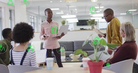 Team Presenting Sustainable Office Strategy with Digital Eco Icons and Collaboration
