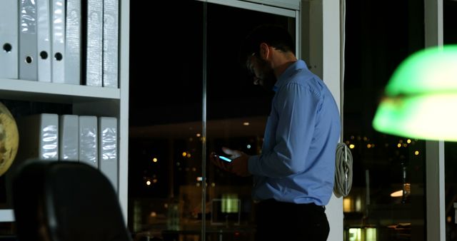 Businessman Working Late Night on Smartphone in Office - Download Free Stock Images Pikwizard.com