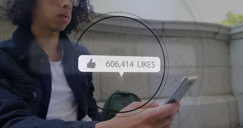 Young Man Engaging with Social Media Analytics Display