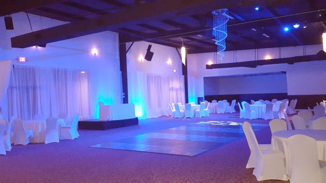Empty Event Venue With Blue Lighting and White Covered Chairs - Download Free Stock Images Pikwizard.com