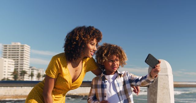 Mother and Son Taking Selfie Outdoors on Sunny Day - Download Free Stock Images Pikwizard.com