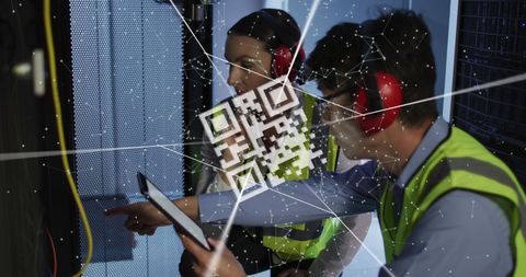 Engineers in server room analyzing data with digital qr code
