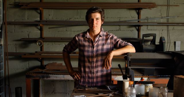 Pensive Woodworker in Plaid Shirt Standing in Workroom - Download Free Stock Images Pikwizard.com