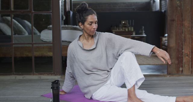 Calm Woman Practicing Yoga Indoors on a Mat - Download Free Stock Images Pikwizard.com