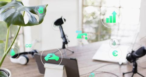 Podcast recording workspace showing sustainability icons, microphone, headphones, plant