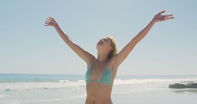 Woman Enjoying Sunny Day at the Beach - Download Free Stock Images Pikwizard.com