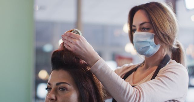 Hairdresser Wearing Face Mask Styling Clients Hair in Salon - Download Free Stock Images Pikwizard.com