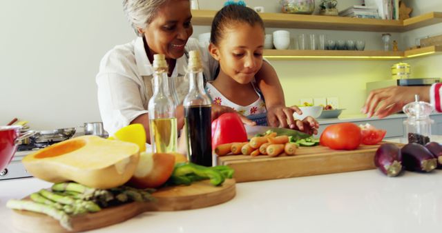 Grandmother and Granddaughter Preparing Vegetables Together in Kitchen - Download Free Stock Images Pikwizard.com