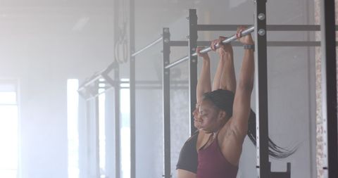 Women Empowerment through Partner Pull-Up Training in Gym - Download Free Stock Images Pikwizard.com