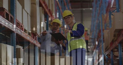 Warehouse Workers Analyzing Data with Financial Charts Overlay - Download Free Stock Images Pikwizard.com