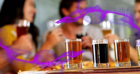 Beer tasting flight sitting on bar counter with friends enjoying rustic brewery atmosphere