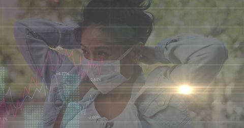 Woman Wearing Face Mask Amid Digital Data With Sunflare
