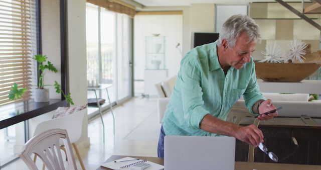 Senior Man Using Smartphone in Modern Home Office - Download Free Stock Images Pikwizard.com