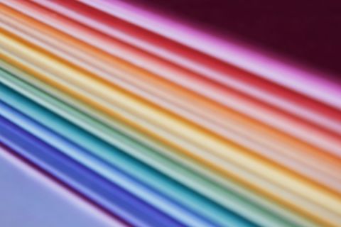 Vibrant array of multicolored paper sheets