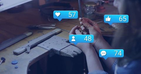 Jeweler Crafting Ring with Social Media Interaction