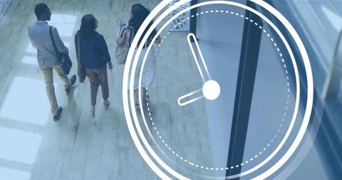 Young professionals walking and talking in modern office lobby with clock overlay