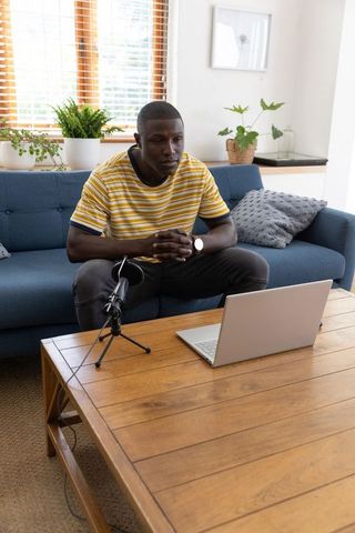 Man Engaging in Vlogging Session from Comfortable Home Setting
