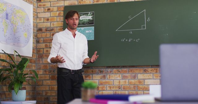 Math teacher explaining the Pythagorean theorem in a classroom. Brick wall and blackboard featuring geometrical figures and mathematical formulas. Ideal for use in educational content, teacher training programs, and material on math tutorials.
