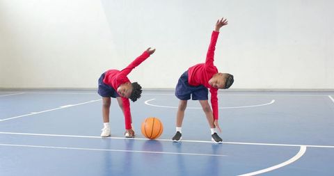 Youth Basketball Teammates Energized in Sports Stretching Routine