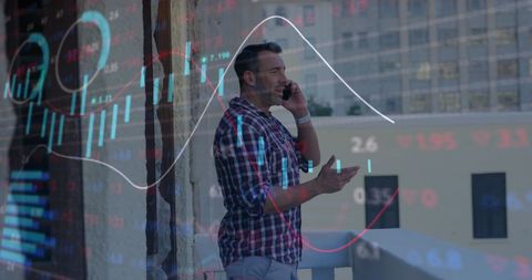 Businessman talking on smartphone with stock market overlay