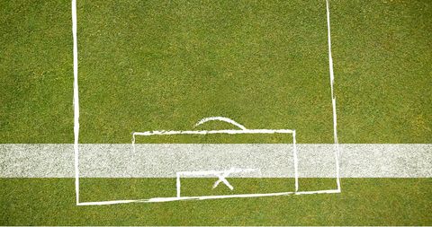 Soccer game plan overlay on green field