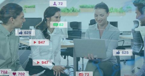 Colleagues Collaborating in Open Office on Social Media Strategy