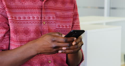 Man in Office Using Smartphone