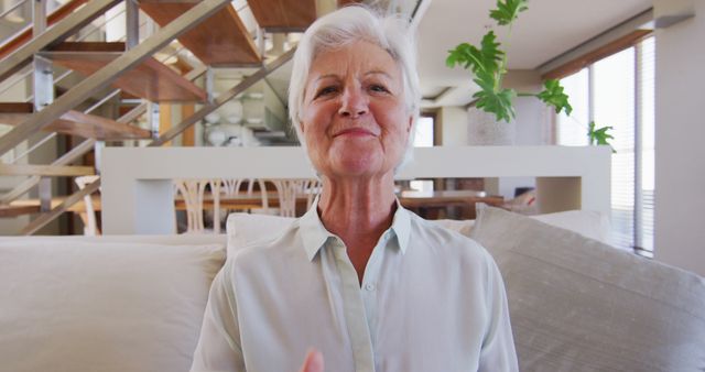 Smiling Senior Woman Relaxing on Modern Living Room Couch - Download Free Stock Images Pikwizard.com